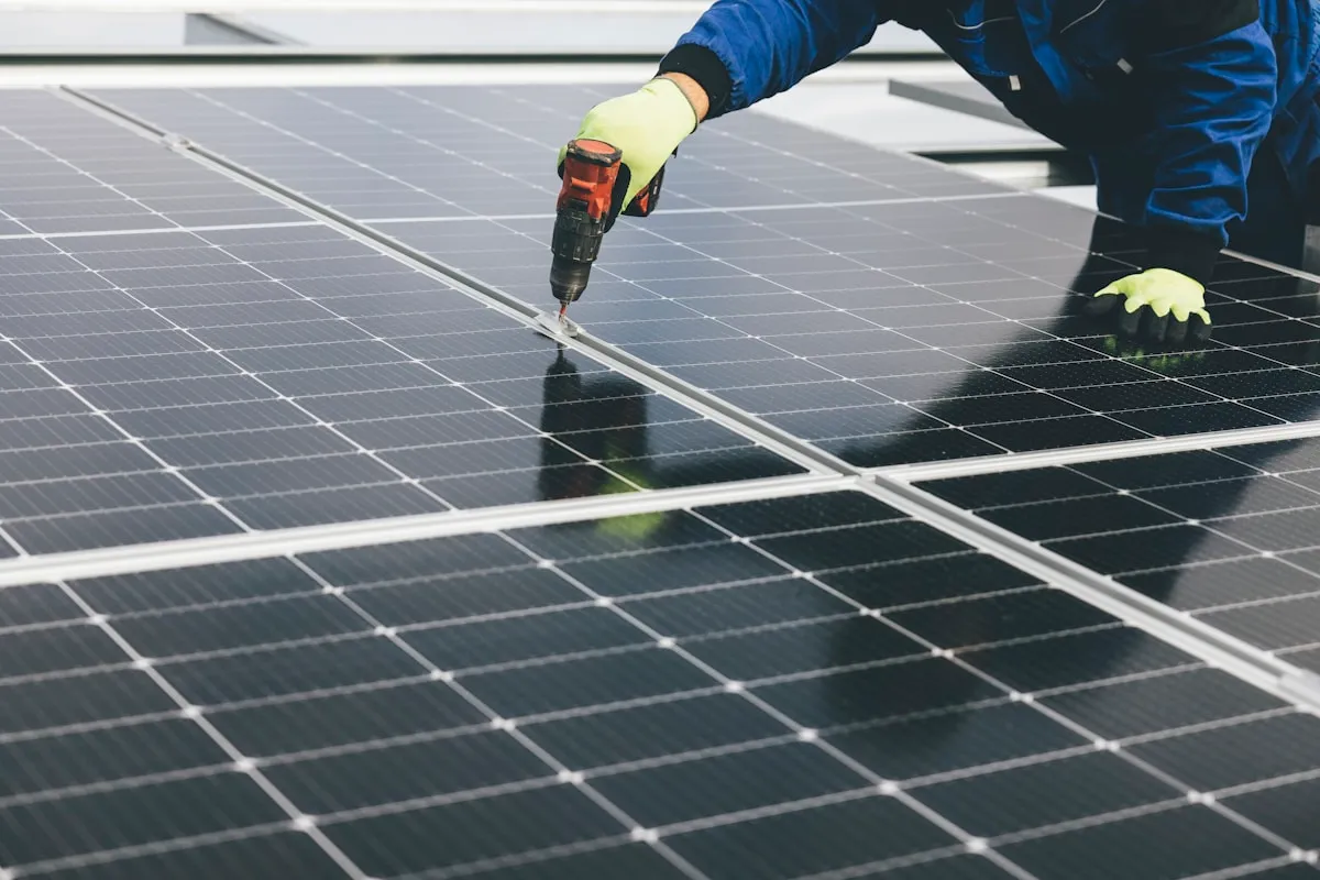 A person working on a solar panel installation outdoors