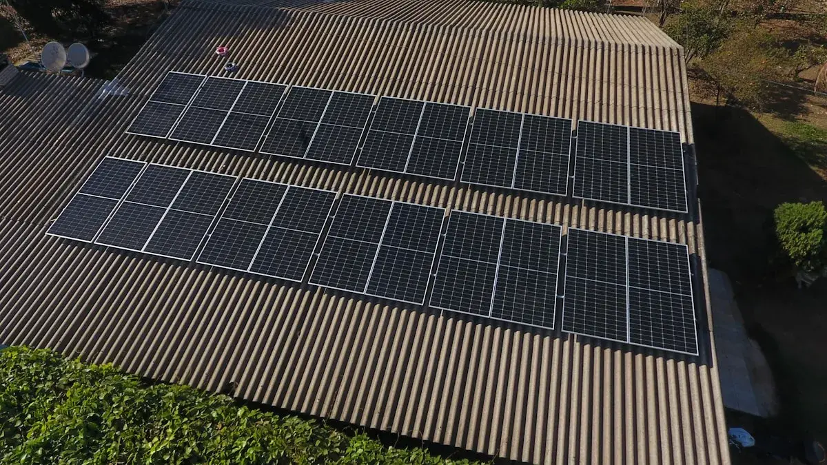 Solar panels installed on a corrugated metal roof, aerial view