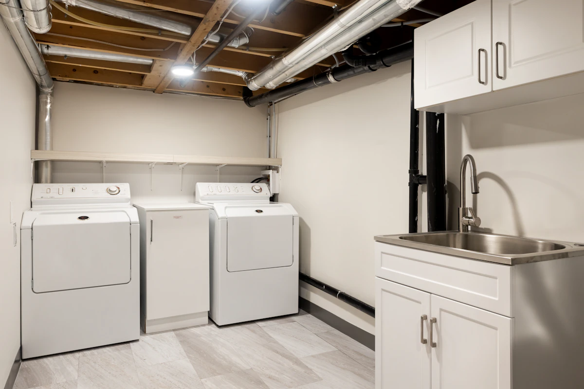 A residential laundry room with a washer and dryer