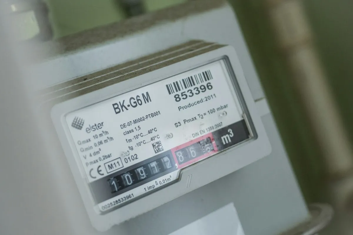 Close-up of a domestic electricity meter mounted on a wall