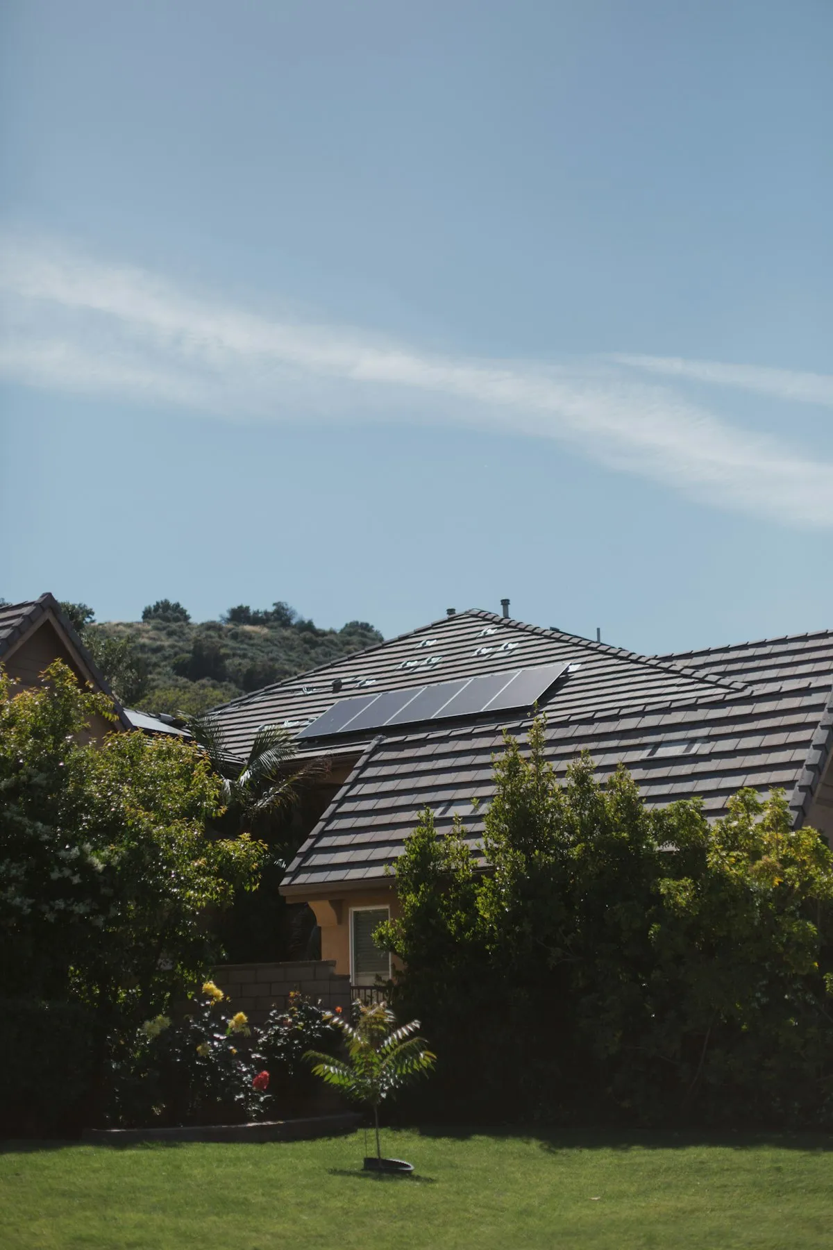 Modern home with a sleek Tesla Solar Roof integrated into the architecture
