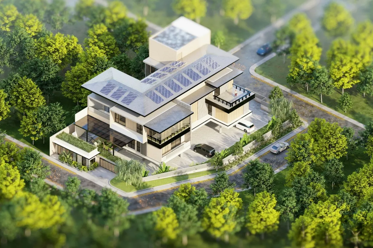 Aerial view of a modern house with solar panels surrounded by green trees
