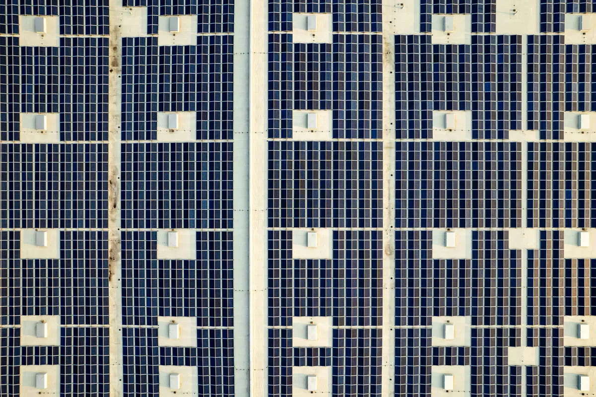 Dense grid of panels covering a large roof, generation at real scale